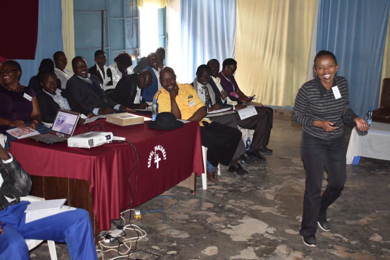 Sharing a light moment during vaccine literacy training for representatives of various religious organizations in the Gospel Parliament